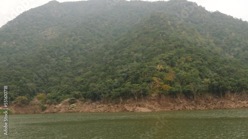 A bushy mountain, hill and sea photo