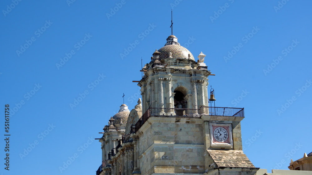 Side view of the bell tower with a clock on the Oaxaca Cathedral in Oaxaca, Mexico