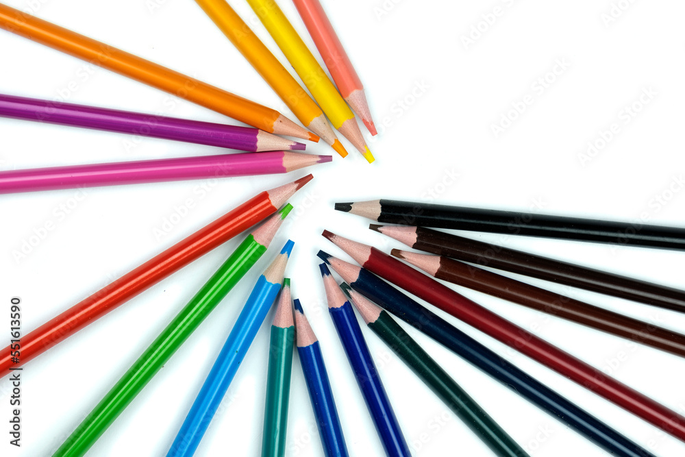 Colored pencils isolated on a white background, a place for advertising. Colored pencils isolated on a white background, a place for advertising.