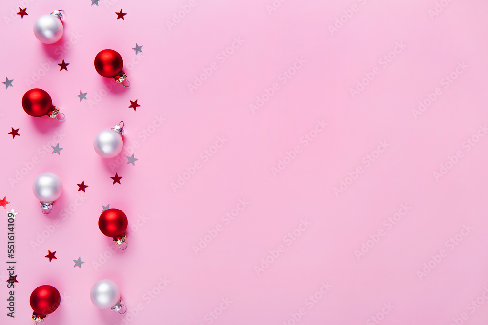 Creative holiday pattern. Christmas background of red and white baubles on a pink background. Creative holiday pattern. Christmas background of red and white baubles on a pink background.