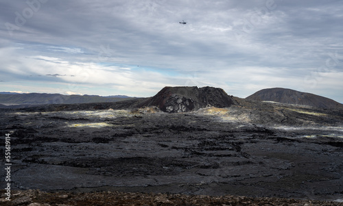 Helicopter flying over Fagradalsfjall volcano and lava field at Reykjanes, Iceland. Huge lava field from an eruption in 2021