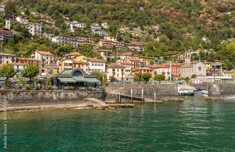 Argegno, Lombardy, Italy - September 5, 2022: View on the Argegno village with the Holy Trinity Church, on the shore of Lake Como.