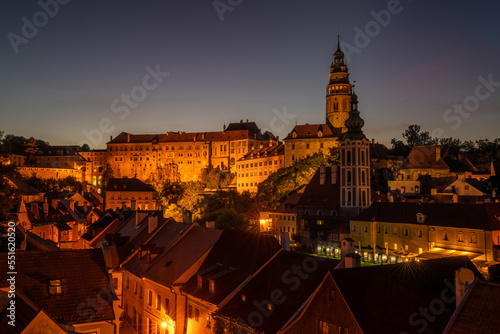 Dreamy night view of iconic historical city Cesky Krumlov with magical sky and lights from streets on early evening in magical hour in south of Bohemia, Europe.