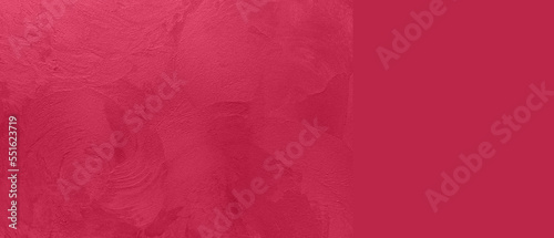 Abstract viva magenta painted texture as background with copy space. Pattern in trendy color 2023 year Viva Magenta.
