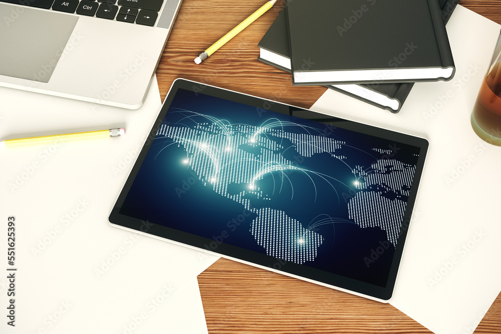 Top view of modern digital tablet monitor with abstract world map with connections, research and strategy concept. 3D Rendering Top view of modern digital tablet monitor with abstract world map with connections, research and strategy concept. 3D Rendering