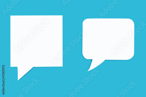 Paper speech bubbles of different shapes on a blue background. Flat white chat icons in the form of empty speech bubbles. Free space for text or image. The concept of communication in the modern world