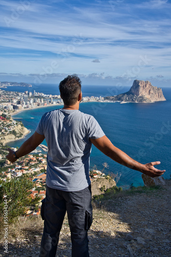 Attractive man celebrating the moment with positive energy. Blurred background.