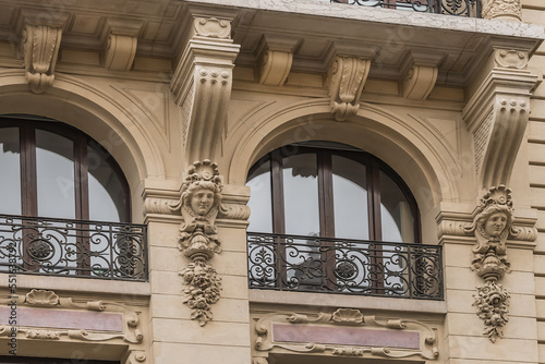 Traditional old French house  balconies and windows. Paris  France.
