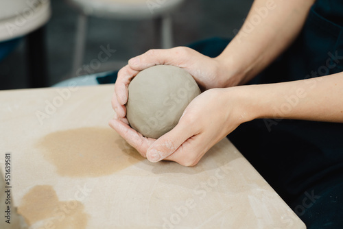 Cuadro en lienzo Potter wedging and balling clay ready to throw on pottery wheel in ceramic studi