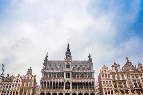 Maison du Roi or King's House surrounded by other guild houses in the Grand Place in Brussels Belgium against a blue sky. It is now the Museum of the City of Brussels.