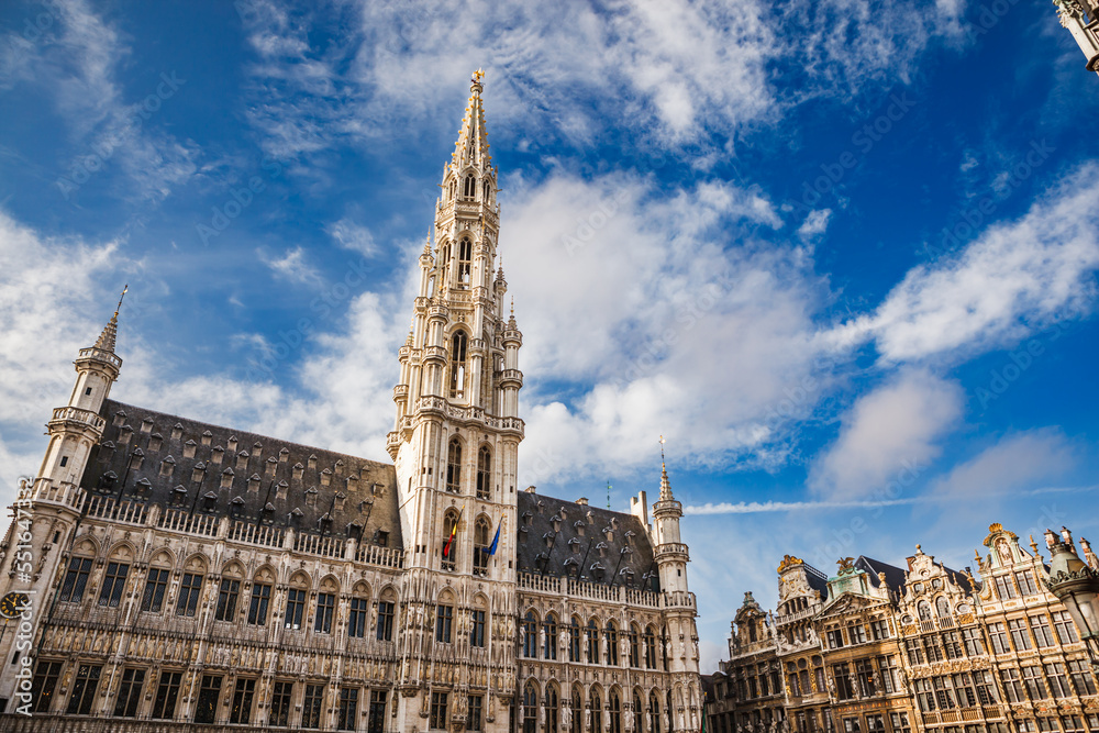 Brussels Town Hall building with tall spire and other guild houses in the Grand Place in Brussels, Belgium