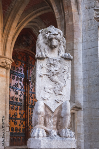 Lion statue in front of the Brussels Town Hall building in the Grand Place in Brussels, Belgium