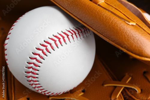 Leather baseball glove with ball, closeup. Sportive equipment