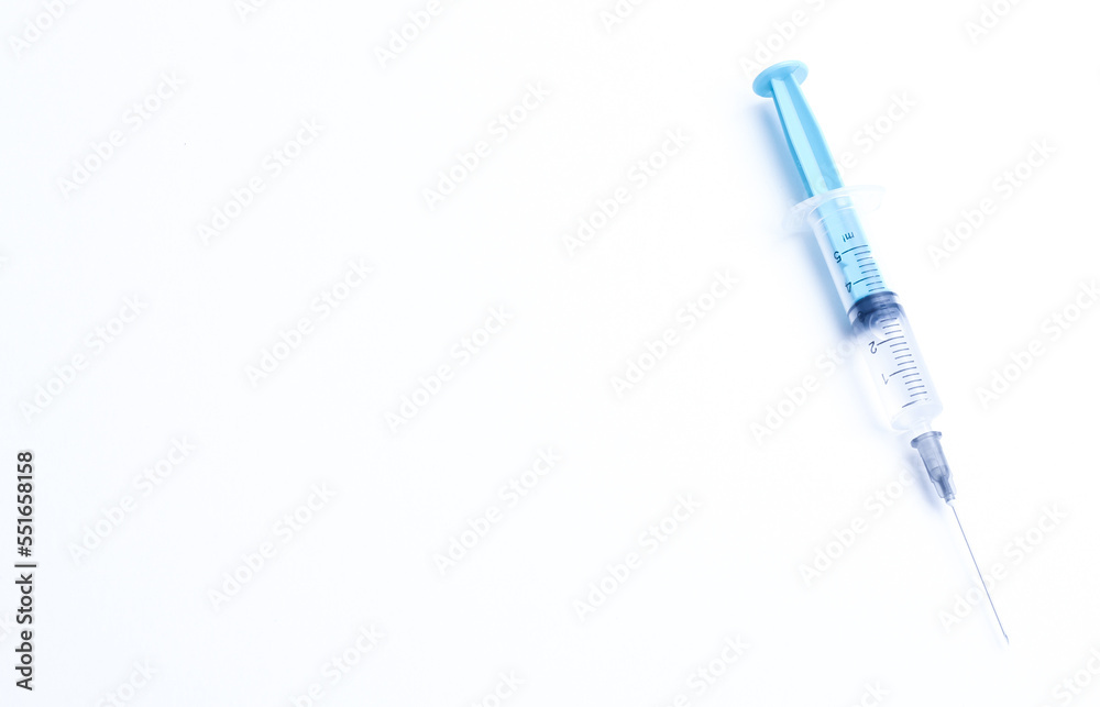 Medical syringe on a white background. A syringe for injection. The concept of health and beauty Medical syringe on a white background. A syringe for injection. The concept of health and beauty