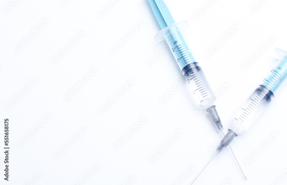 Medical syringe on a white background. A syringe for injection. The concept of health and beauty