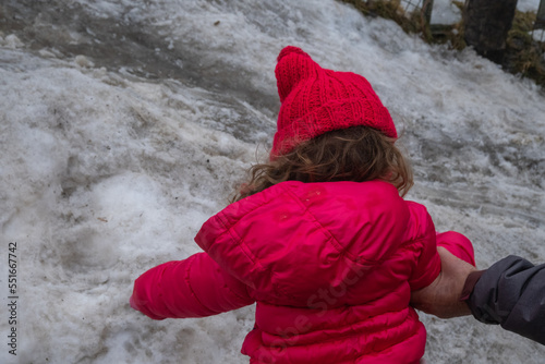 Mother and little daughter playing in the snow at Sierra Nevada Ski Resort