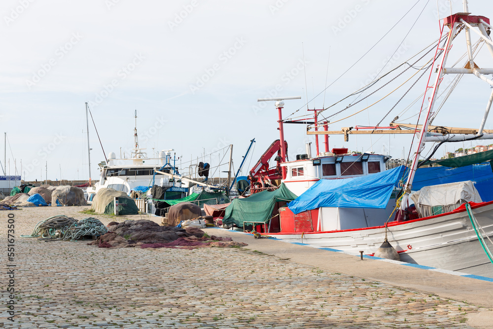 Fishing in port in the town of Sant Feliu de Gixols in the province of Girona, Catalonia, Spain. Fishing in port in the town of Sant Feliu de Gixols in the province of Girona, Catalonia, Spain.