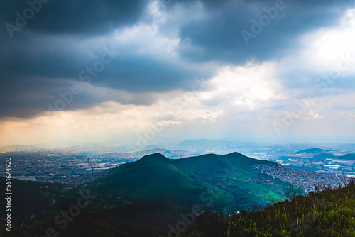 mountains surrounded by city with gray cloud sky in sierra de guadalupe tultitlan 