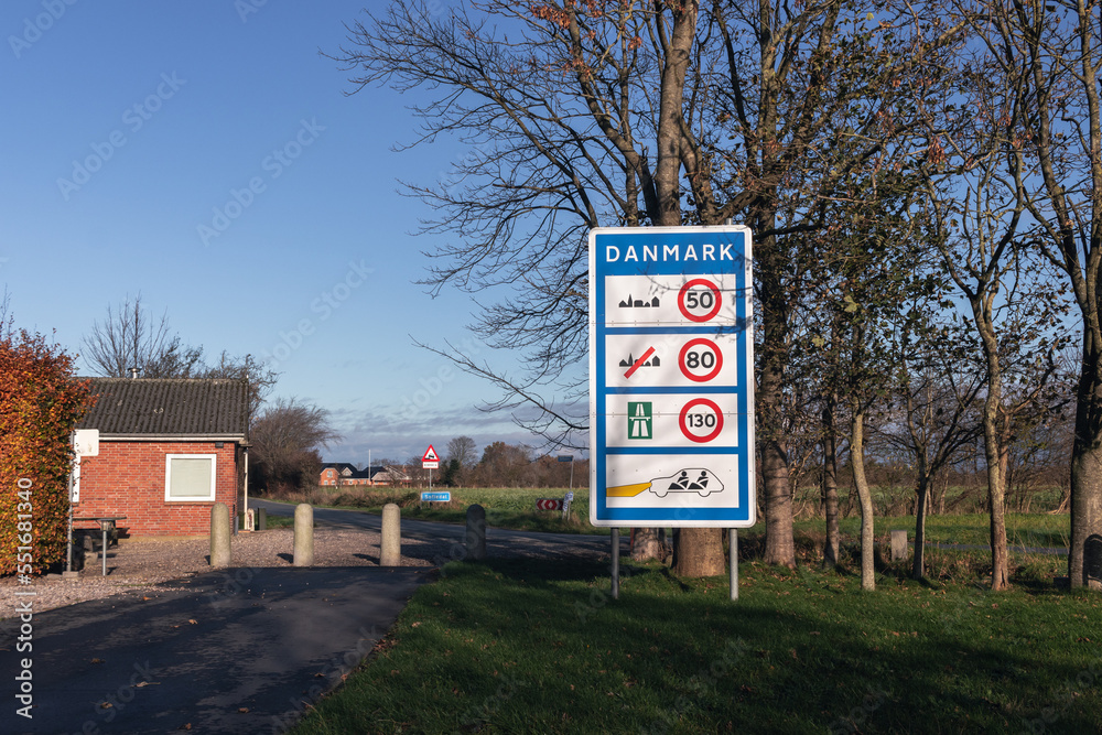 Sign with information about speed limits in Denmark at Denmark - Germany border crossing point.