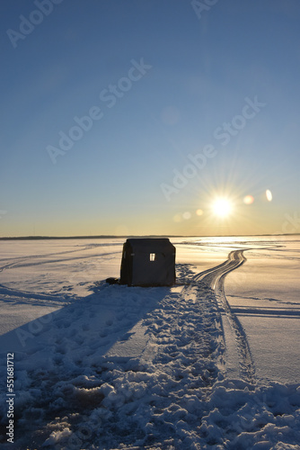 Quadro em tela An ice shanty silhouette at sunset
