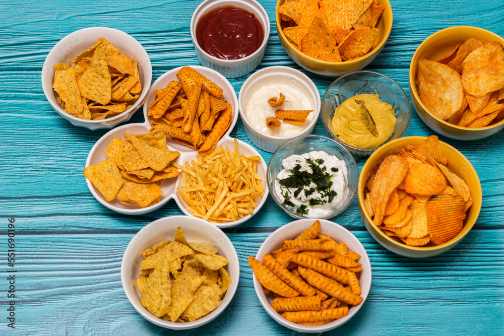 Salty snacks assortment and dipping sauce Salty snacks assortment and dipping sauce