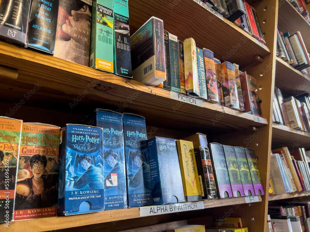 Fototapeta premium Redmond, WA USA - circa November 2022: Close up view of used audiobooks for sale inside a Half Price Books.