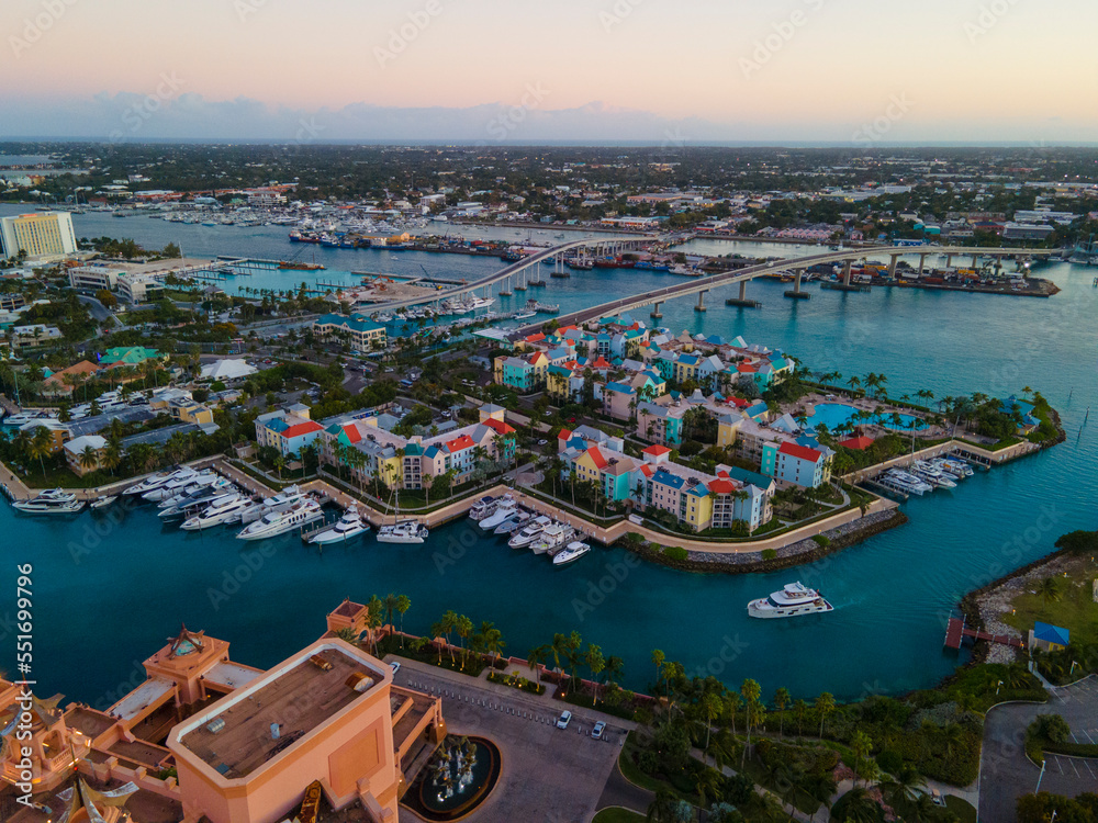 Harborside Villas aerial view with sunset twilight at Nassau Harbour with Nassau downtown at the background, from Paradise Island, Bahamas.