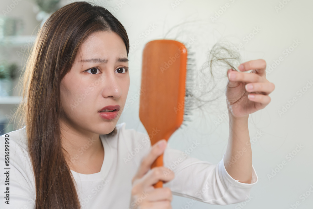 Hair loss problem, Asian woman look at scalp worry about balding. Hair loss problem, Asian woman look at scalp worry about balding.