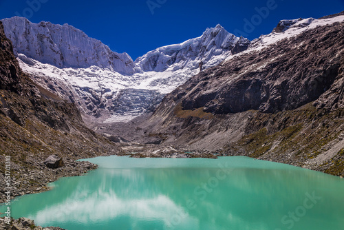 Fototapeta Naklejka Na Ścianę i Meble -  Llaca lake in Cordillera Blanca with snowcapped Andes, Ancash, Peru