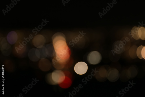 Blurred view of colorful glowing lights outdoors, bokeh effect © New Africa