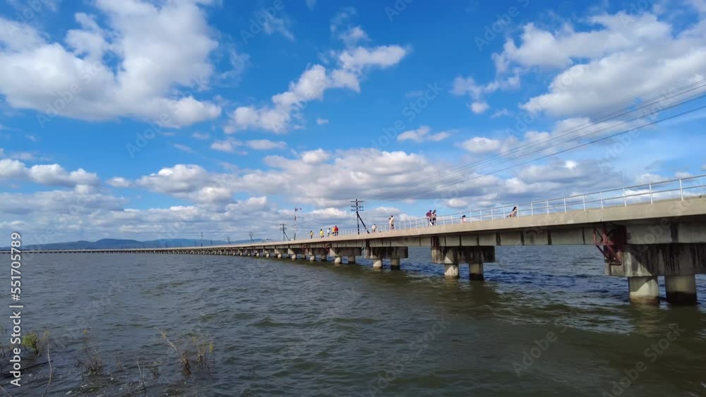 05,Dec,2022,lopburi Thailand,Group of tourists who go sightseeing and take photos on the railway bridge of Pa Sak Dam in Thailand 05,Dec,2022,lopburi Thailand,Group of tourists who go sightseeing and take photos on the railway bridge of Pa Sak Dam in Thailand