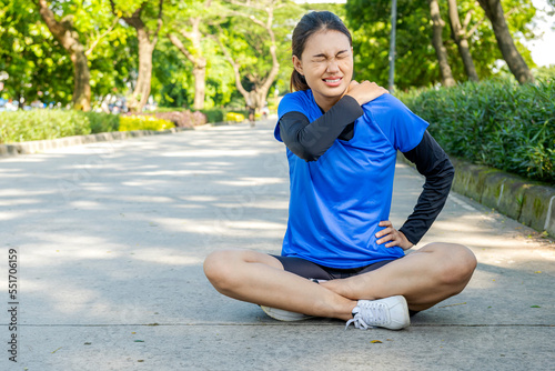 Asian woman sitting and feeling back pain