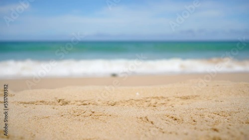 Beach sand close up white sand beach and sea. focused sandy beach blurred sky 
