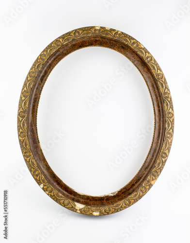 Old antique oval wooden picture frame isolated on white background.