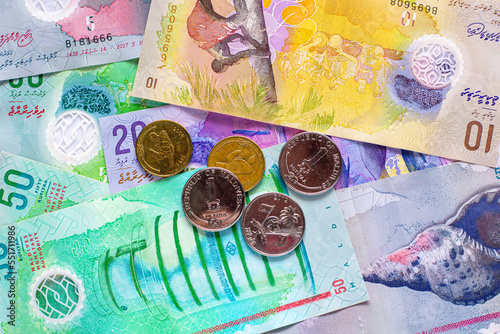 Fototapeta Naklejka Na Ścianę i Meble -  Group of money Maldives banknotes and coins on a white background. Maldives Currency rufiyaa note and coins , rufiyaa bank note, Maldivian rufiyaa money. Money and finances concept.