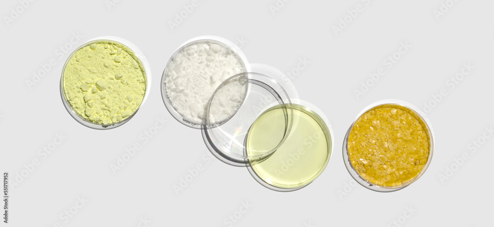 Sulfur Powder, Cetyl esters wax, Poly Aluminium chloride liquid and Carnauba Wax in Petri dish on white laboratory table. Chemical ingredient for Cosmetic and Toiletries product. Top View Sulfur Powder, Cetyl esters wax, Poly Aluminium chloride liquid and Carnauba Wax in Petri dish on white laboratory table. Chemical ingredient for Cosmetic and Toiletries product. Top View