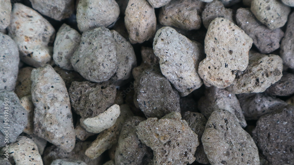 Detailed surface texture of a pile of pumice as a background Detailed surface texture of a pile of pumice as a background