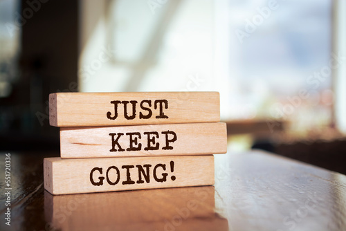 Wooden blocks with words 'Just keep going'.