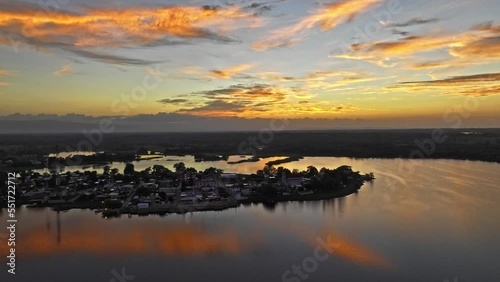  HQ Aerial footage - Drone moving a little bit to the side ans stopting with reflection on clouds in the water in the middle of the town