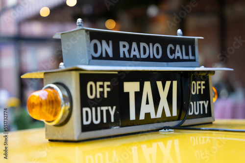 Obraz na plátně Close up of an old style yellow taxi cab top light.