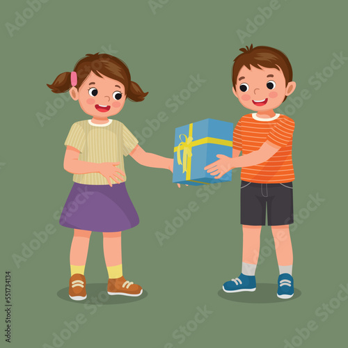 happy little girl giving gift to her boy friend for his birthday or Christmas present 