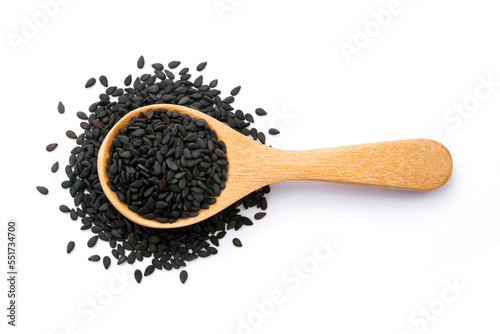 Black sesame seeds in wooden spoon isolated on white background , top view , flat lay.