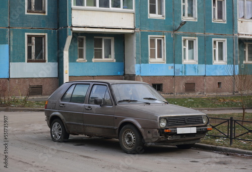 An old gray rusty car is parked in the yard, Iskrovsky Prospekt, St. Petersburg, Russia, December 2022