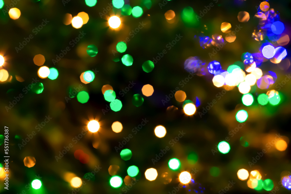 Textured festive background with blurred orange-green lights