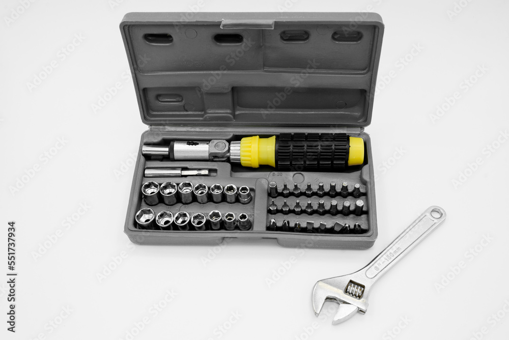 small set of tools in a case with a screwdriver with removable bits and a ratchet wrench small set of tools in a case with a screwdriver with removable bits and a ratchet wrench