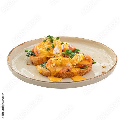 Portion of eggs benedict toast with salmon and herbs breakfast