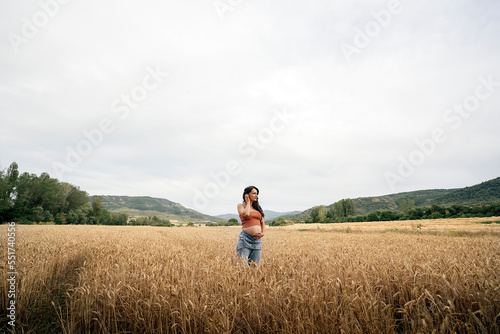 Pregnant young woman in wheat field © santypan