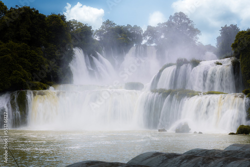 Gorgeous Detian falls or Ban Gioc falls between China and Vietnam. The waterfalls increase the quality of life for people who live within the sound of the falls. Horizontal image with copy space