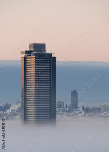 A thick fog blanket covering Metro Vancouver on a winter morning during sunrise in Burnaby  British Columbia  Canada