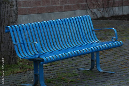 Blue park bench outdoors.